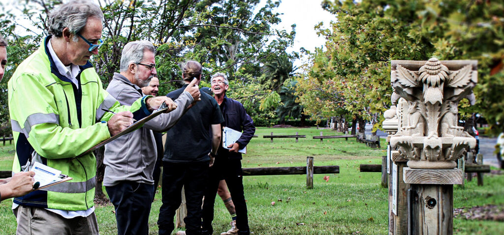 Judges taking photos and scoring sculptures