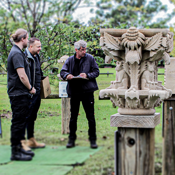 Judges scoring sculptures